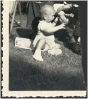 Robert Butler as a baby.  His father's image has been torn from the picture