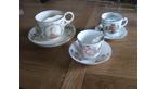 three comemorative moustache tea cups