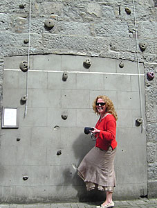 Marie McStay trys her hand on the army barracks climbing wall