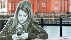 child texting on a mobile phone