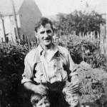 Raymond (holding the apple) and his brother, Graham,  helping their father install the air raid shelter in Nelson Road, Northfleet