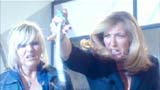 Yvonne pulls out ear piece from Torchwood employee. YUK!