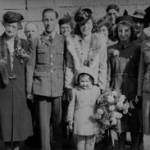 From left to right - Mrs Elizabeth Hitchings, Mr William Hitchings, Mrs Beatrice Maud Monks, Mr William Hitchings, Flight  Sgt John A Monks (groom), Miss Ann Monks, Miss Gwen Hitchings (bride), Mrs Evelyn Moore, Gunner Partridge, Miss Betty Hitchings, Mr Fred Smith, Mrs Doreen Rowlands (nee Hitchings) and Mr Norman Hitchings. In front - Miss Rosemary Mendus.