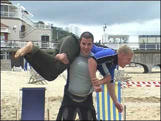 One trainee lifeguard carrying another