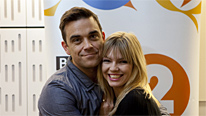 Multi-million-selling solo artist Robbie Williams with BBC Radio 2 presenter Kate Thornton