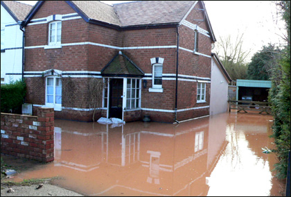Belmont Brook in Hereford bursts its banks