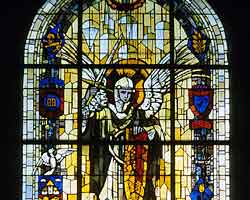 In the church at Ste Mere Eglise there are now stained-glass windows depicting the paratroopers landing