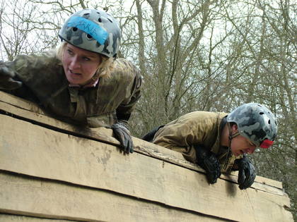 Carrie and Dave climbing over a wall!