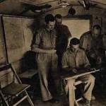 Capt T.L. Ward, Air Liaison  Officer on left advises Group Captain Lewis, commanding Bomber Wing Forward Headquarters Desert Airforce on targets as part of MORU operation at El Alamein