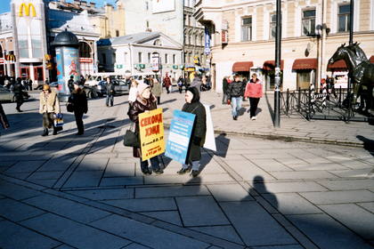 Women advertising their wares outside a metro station in St Petersburg