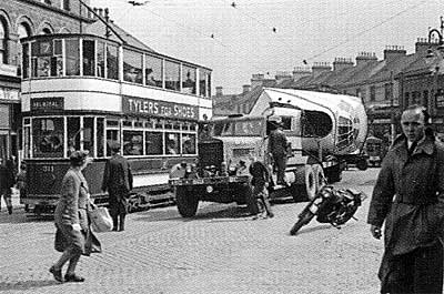 Nose section of a Shorts Sunderland Flying Boat being transported through the streets of Belfast