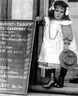 Ellen beside the menu at the Causeway tea-rooms