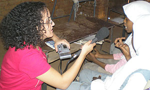 Producer Lina Attalah recording an interview