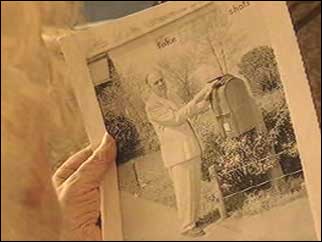 Photograph of Osborne posting a letter