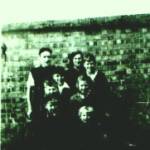 The Griffiths family;  front row left Gerald, then Peter, Second row left; Chris then Sheila, Third Row, left David, then Graham.  Back row, Morgan and Marie.  Photograph taken before they were bombed, the family is stood in front of the brick built Air Raid shelter, in Sunnydene,  Brislington, that saved their lives on that fateful day of 26th April 1942.