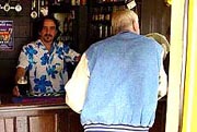 Man drinking in the Nutshell Pub, Bury St Edmunds