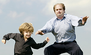 Alexander Waugh and son on a trampoline