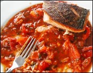 Crispy Salmon with tomato and sweet pepper sauce.