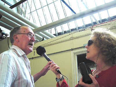 John Feehan shows Marie his former work place in the carding office