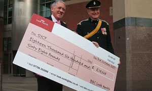 BBC Look North presenter Harry Gration handing over cheque to Mr Jonathan Hunt, Chairman of the South Yorkshire Community Foundation and High Sheriff of South Yorkshire