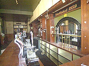 empty shelves behind the bar