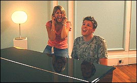 Picture: Jake and Holly at the Fame Academy piano