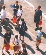 Boys preparing for a water fight in Warsaw
