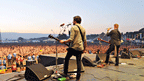 Josh Homme plays to the Reading Festival at sunset.