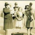 (L to R) Nurse Richards Jones holding Anne, Mr Williams, Mrs Thomas and Lily, her daughter, Mum carrying David.  Waiting at Ferryside for the train to Birmingham.