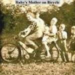 Ruby's mother on a bicycle (she was in her 60's.  Also son-in-law Bill Thompson,baby Norman Thompson, Mervyn Thompson, Raymond Thompson (7 years old) and George Purdy (4 years old).