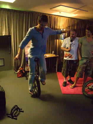 In their fancy dressing room, Jason likes to relax on his unicycle.