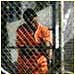 A photgraph of a prisoner at Camp X-Ray, Cuba.