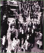 Crowd coming out of mill