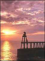 Witby pier sunrise by John Greenwood
