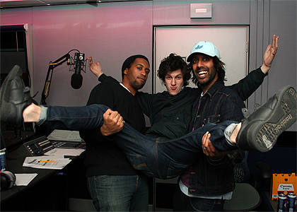 Nothing says 'Nice one' like three men holding each other.