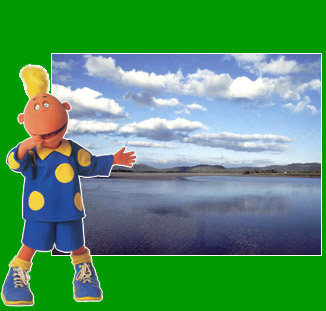 Jake standing in front of lake