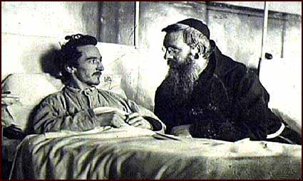 Image of a priest visiting a hunger striker