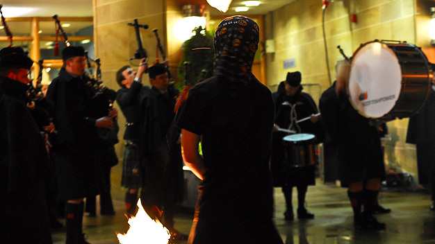 Flame thrower and Scottish Power pipe band.