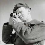 Me with my Robot wind-up  automatic camera in Flensburg while in the Army of Occupation,1947, bought illicitly with my army ration of cigarettes, as I didn't smoke!