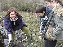 Picture: Helen Baczkowska of the Norfolk Wildlife Trust helps clear the pond