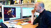 Professor Rob Ivison working at computer