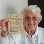Jean Winnan with her father's ration book.  He was called William Leslie Bolitho and he lived at Glenview in Penryn