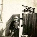 Derek Pearson aged 9 showing gap in the fence for the neighbours Derek Pearson aged 9 showing gap in the fence for the neighbours
