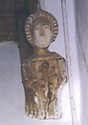 Image of a carved wooden angel on the wall at Kirtling parish church