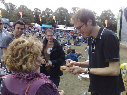 Steve signs a tambourine