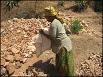 Woman making a dam