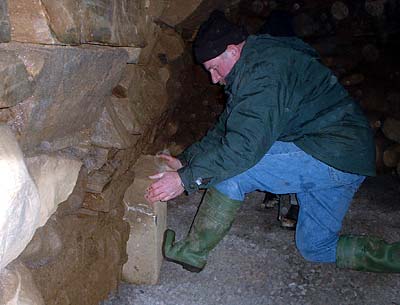 Oliver Quail shows a secret stone which can be slid out to reveal a cavity - perhaps once used to hide treasures in?