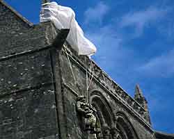 Monument to Paratrooper John Steele who spent the night hanging on a church wall pretending to be dead. He was rescued in the morning