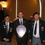 7 June 2004. Jim Jolly (right) and Pat Kelly (left) present a Shield with the Coat of Arms of Workington, Cumbria to the Mayor of Bayeux, Calvados, France, Mr Patrick Gomont. 7 June 2004. Jim Jolly (right) and Pat Kelly (left) present a Shield with the Coat of Arms of Workington, Cumbria to the Mayor of Bayeux, Calvados, France, Mr Patrick Gomont.