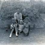 Front: L to R : David and John Hillbery, Raymond Massart Back: Alan Lane, Loline Massart, in front of air  raid shelter Taken at: 252 Lynmouth Avenue, Morden, Surrey, 1942